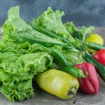Close up photo of organic vegetables. Lettuce leaves with peppers. High quality photo